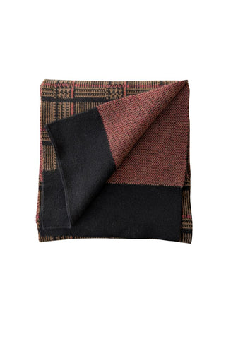 A scarf with a checkered pattern displayed around a mannequin neck.